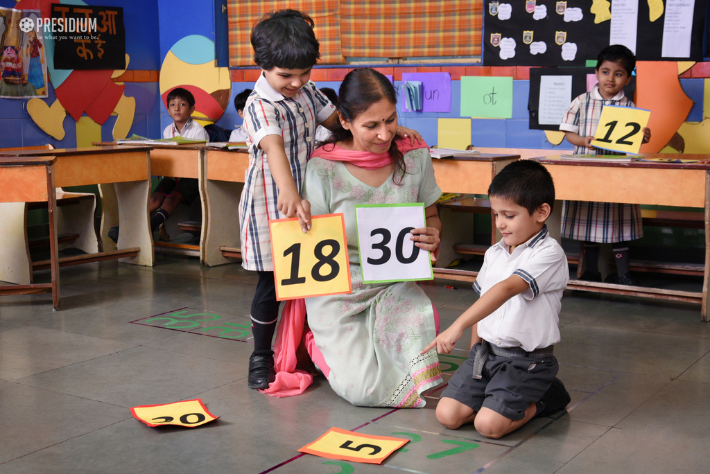 Presidium Dwarka-6, GRADE PREP STUDENTS GUESS MISSING NUMBERS ON A MATH GRID