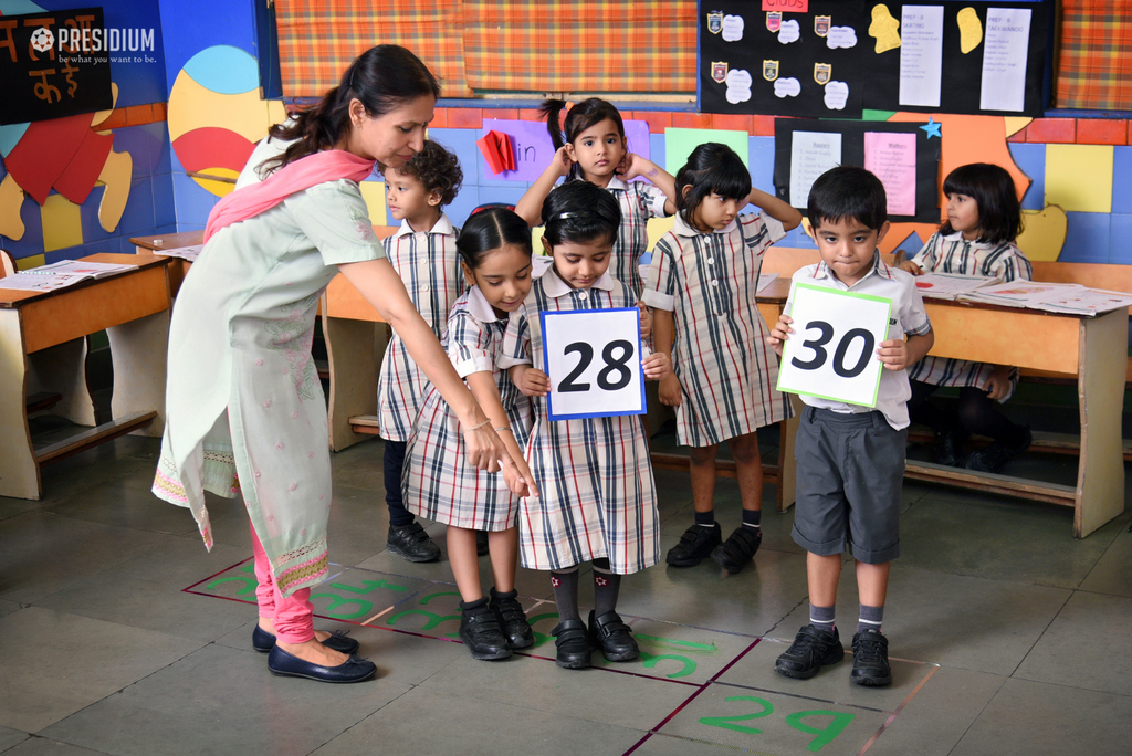 Presidium Dwarka-6, GRADE PREP STUDENTS GUESS MISSING NUMBERS ON A MATH GRID